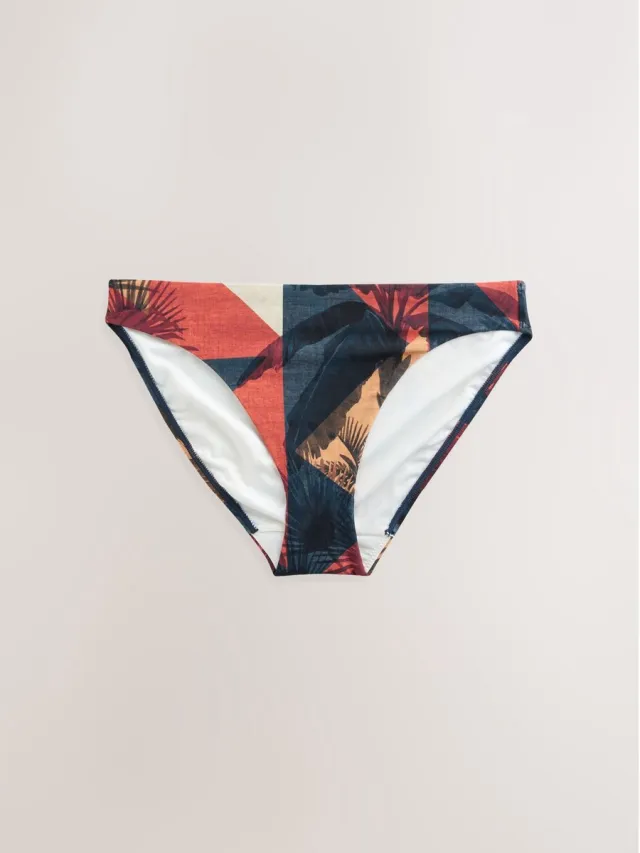 Next Dames - Hoog uitgesneden bikinislip met print - Blauw Navy/Rust Red Palm Print