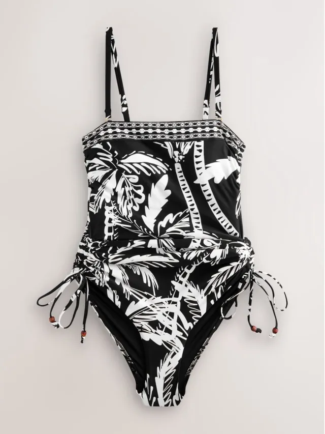 Next Dames - Vormgevend, buikcorrigerend bandeaubadpak met ruches op de pijpen - Zwart Black/Cream Palm